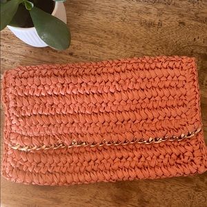 Salmon colored clutch